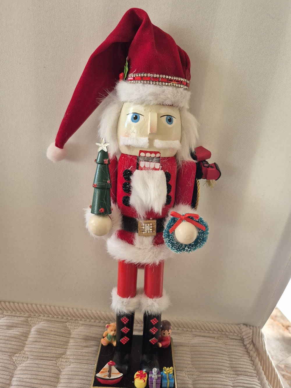 Holiday Red Santa Nutcracker Figurine with Green Tree and Blue Wreath